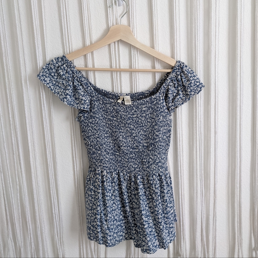 Smocked peplum flutter sleeve blouse